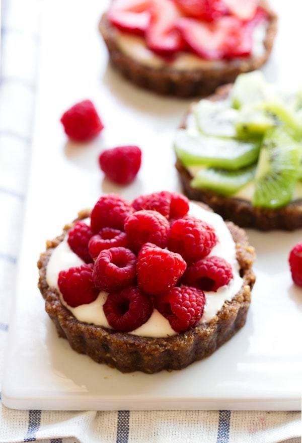 Mini fruit pizza with raspberries.