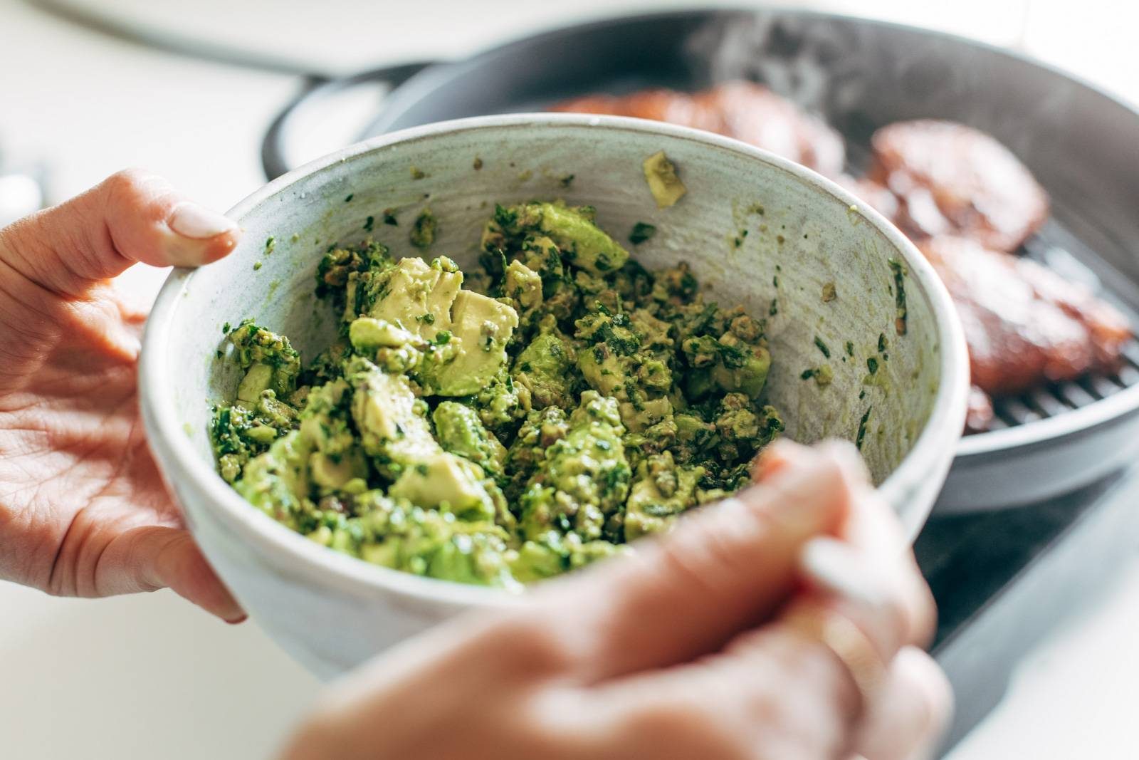 Chunky pistachio sauce in a bowl.