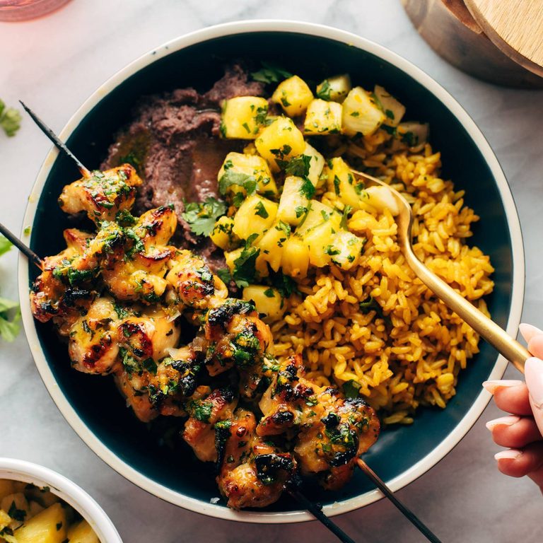 Cilantro orange chicken with rice and beans.