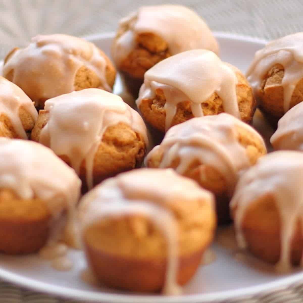 Maple Glazed Pumpkin Muffins on a plate.
