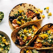 Salmon tacos with cucumber salsa lined up