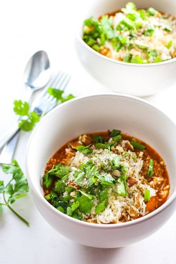 Quinoa Chicken Curry Bowls with a fork and a spoon.