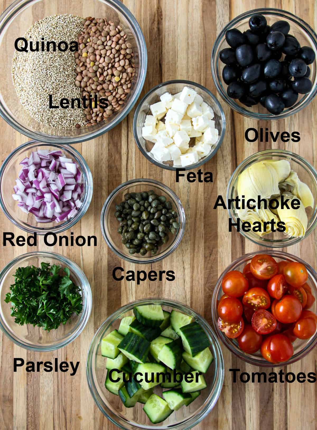 The ingredients for the salad in glass bowls.