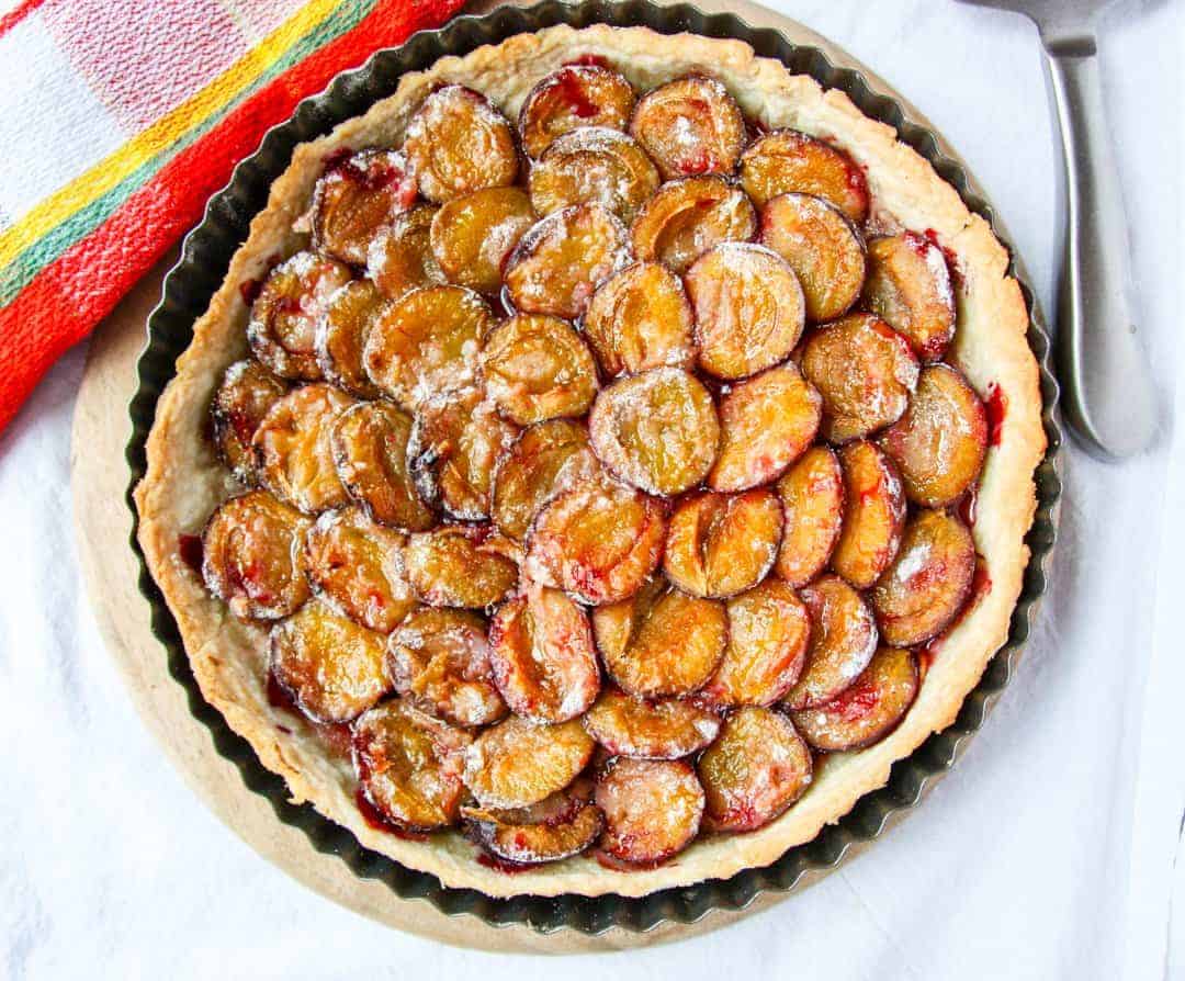 A baked tart in a pan on a table