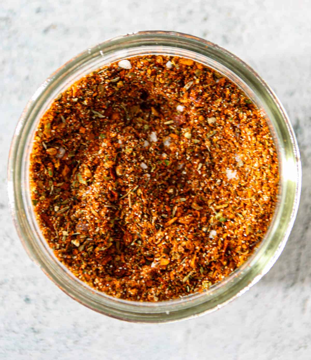 Homemade Cajun seasoning in a glass jar.