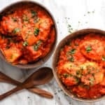 Two bowls of stew on a table