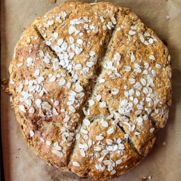 A round loaf of baked gluten-free Irish soda bread.