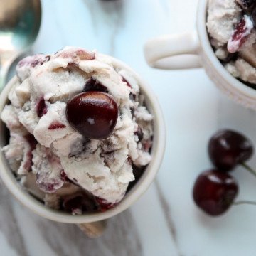 A cherry dessert in a glass bowl, with Cherries