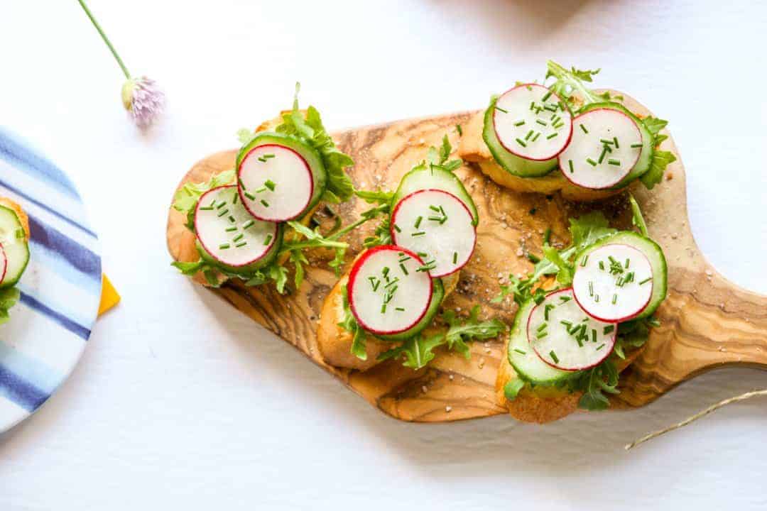 A plate of hors d'oeuvres on a wooden board