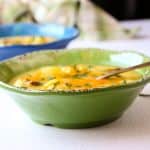 A bowl of soup with a spoon