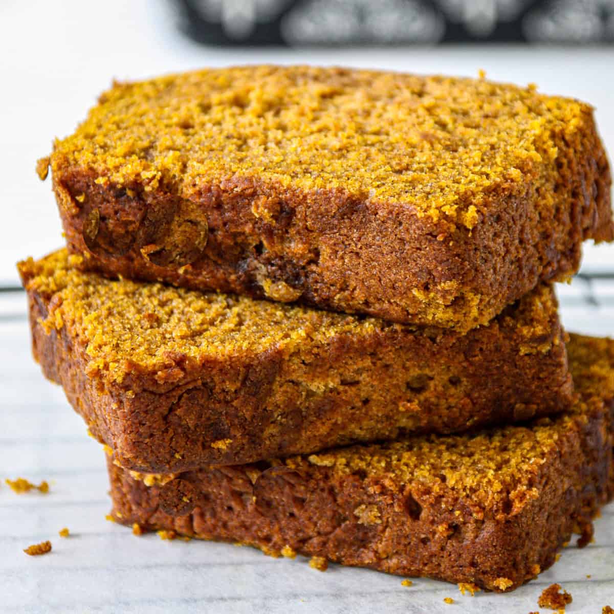 A stack of three slices of gluten free pumpkin loaf