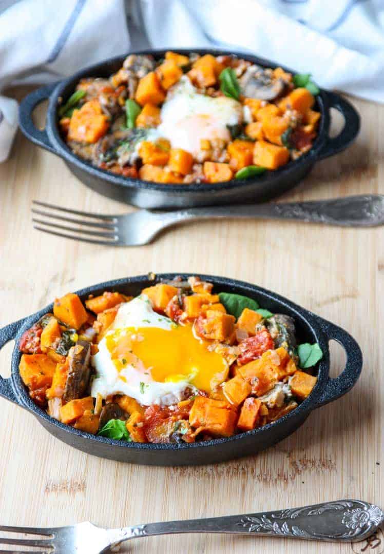 A plate of food with a fork and knife, with Sweet potato