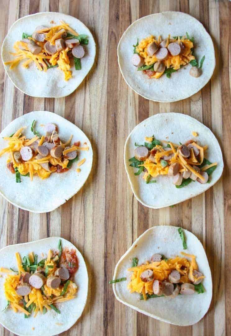 A bunch of food sitting on top of a wooden table