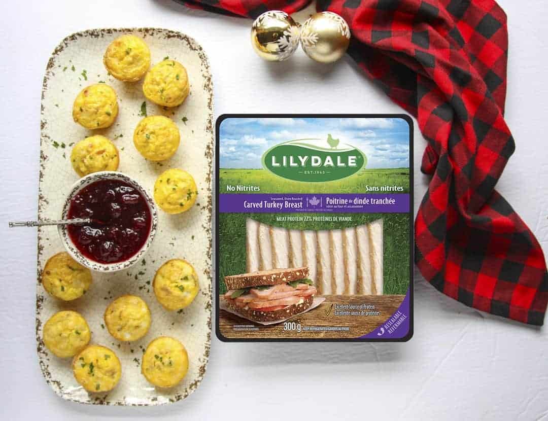 A tray of food with a package of cooked turkey slices