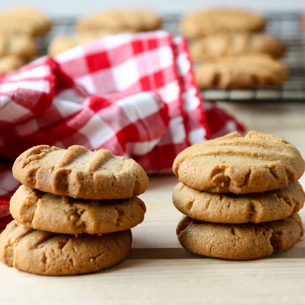 Two stacks of 3 gluten-free peanut butter cookies.