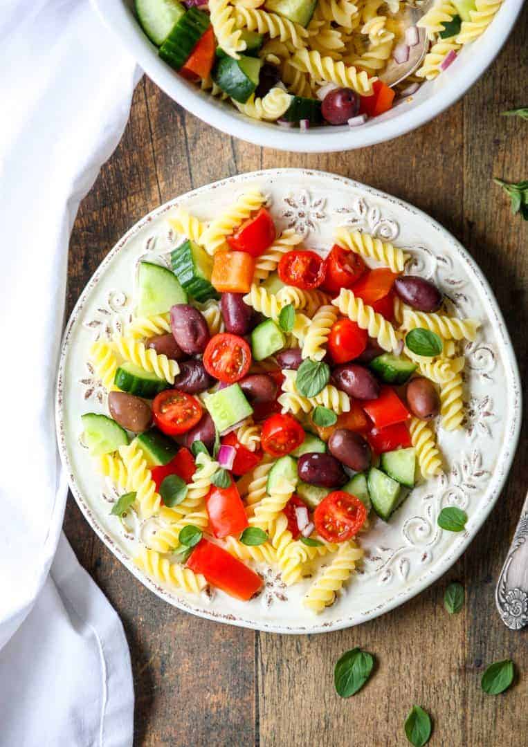 Greek pasta salad on a white plate