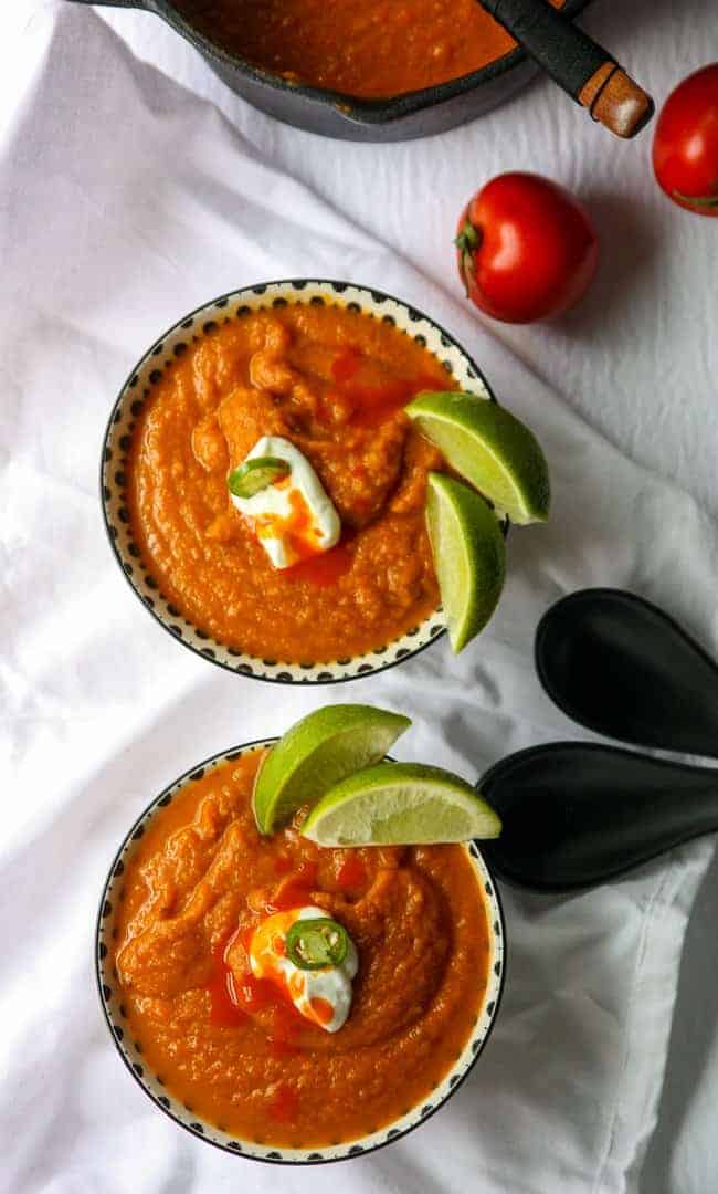 top down shot of two bowls of southwestern pumpkin soup
