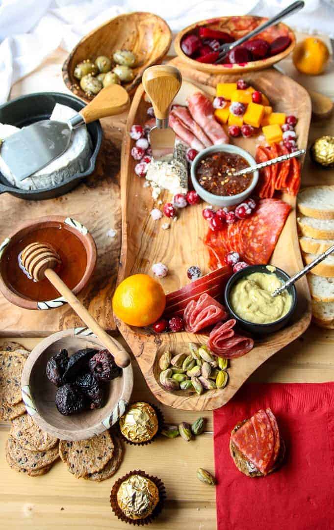 A half empty meat and cheese board