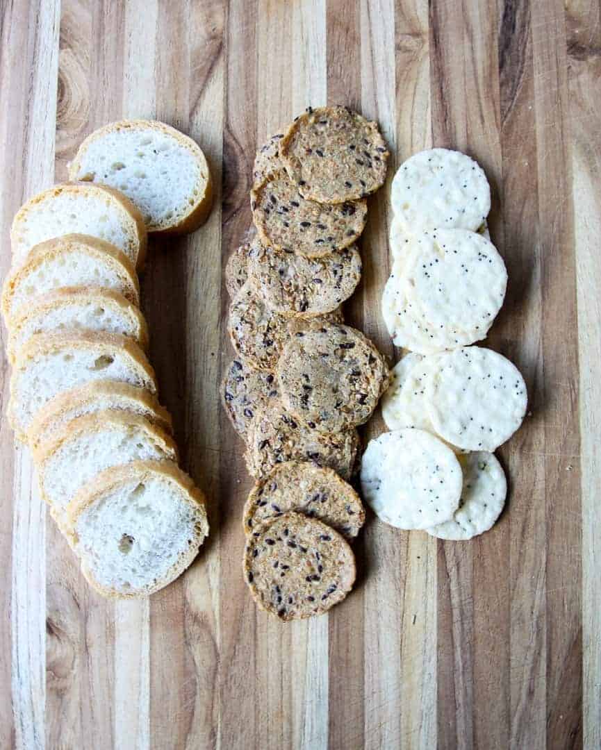 Bread and Crackers on a wooden cutting board