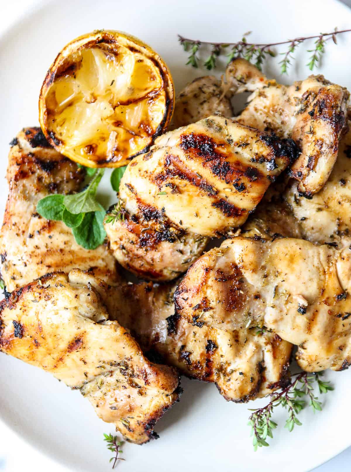 The grilled chicken on a plate ready for serving.