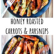 Roasted vegetables piled on a black plate with a silver fork.