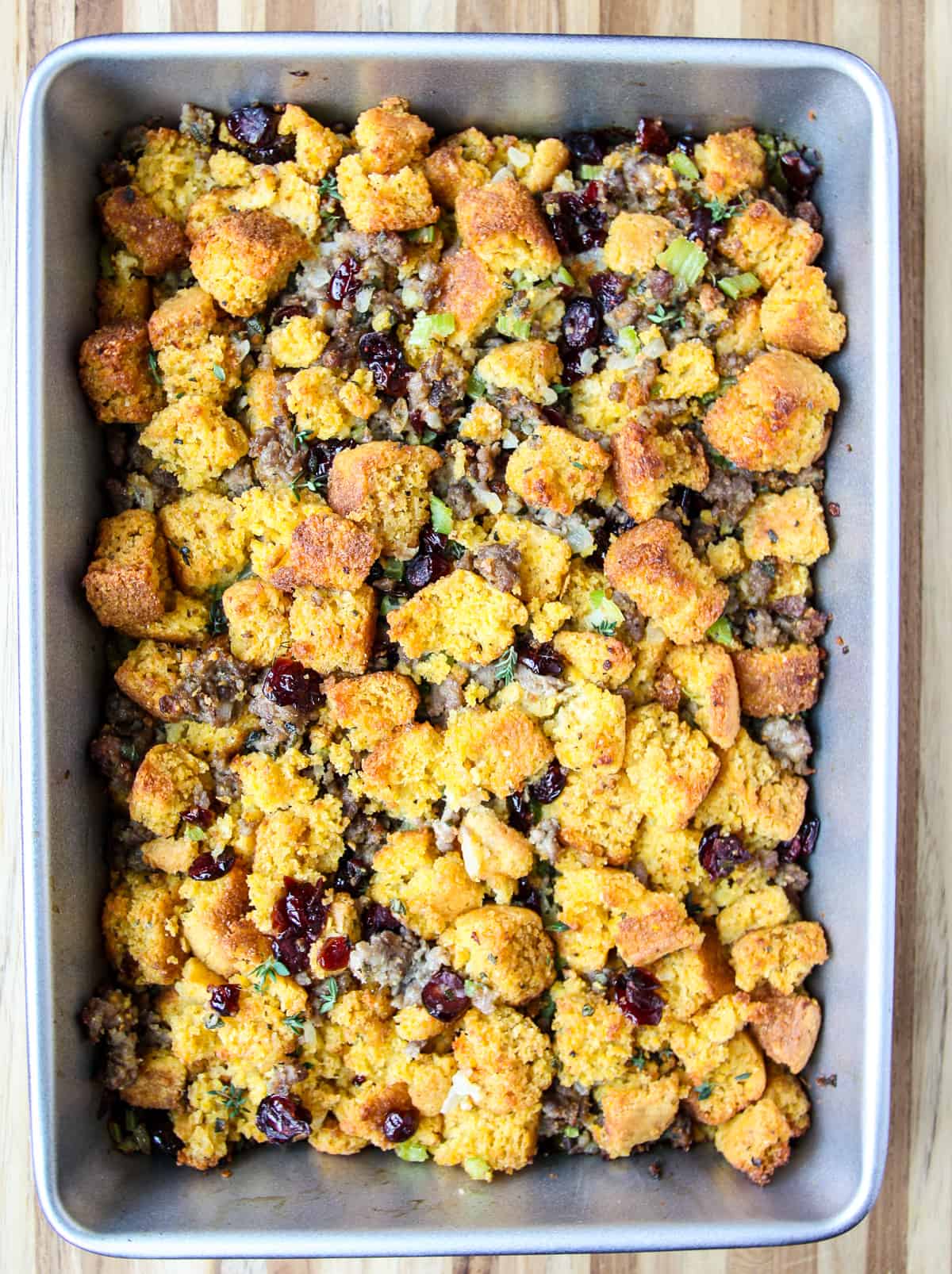 Gluten free cornbread stuffing in a rectangular baking pan.