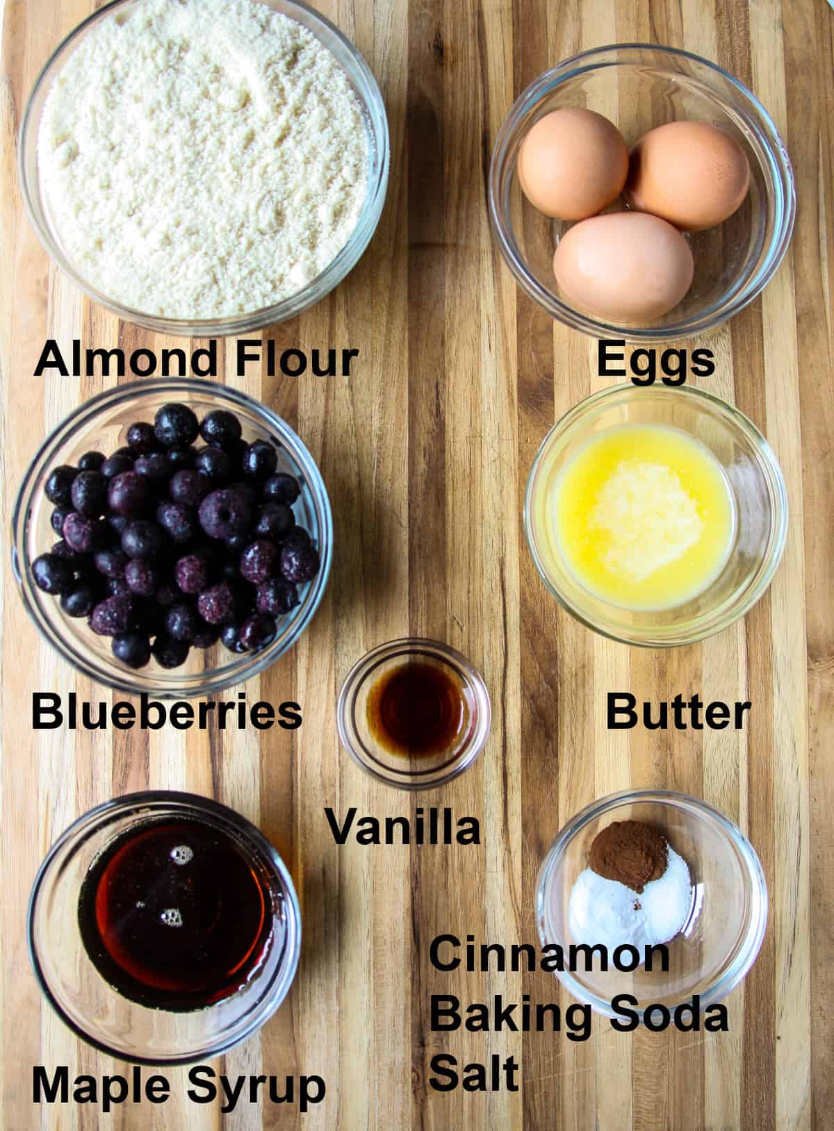 The ingredients for making this recipe in glass bowls on a wooden board.