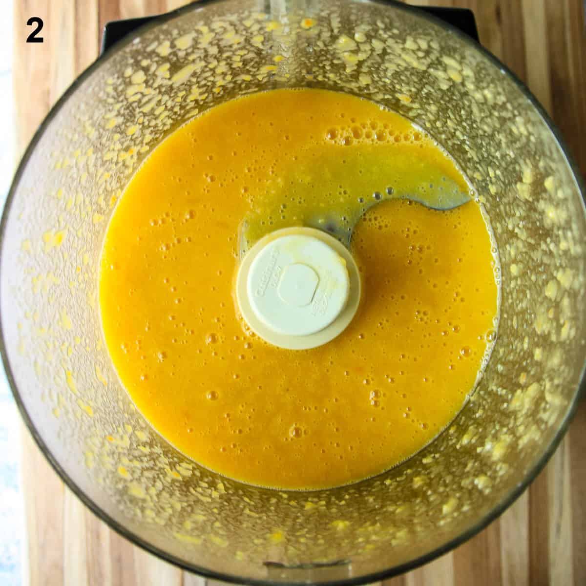 The hot sauce after pureeing the ingredients in the bowl of a food processor.