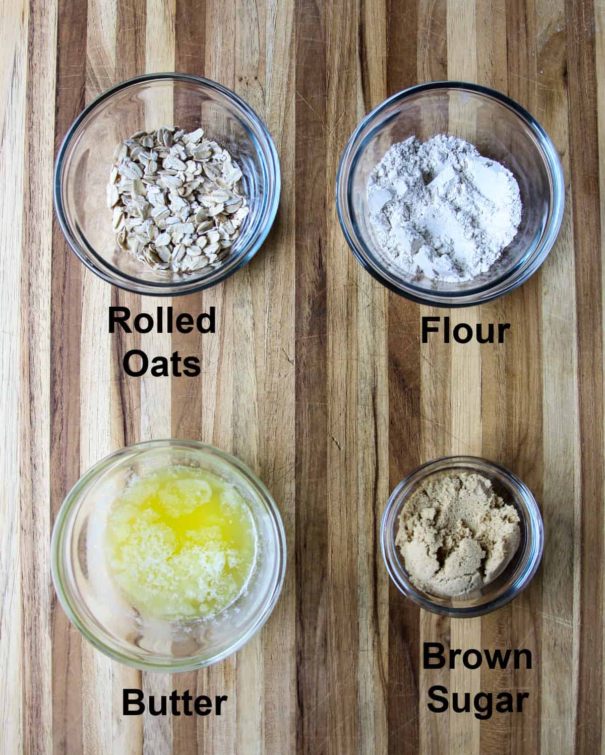 The ingredients for the apple crisp topping, in glass bowls.