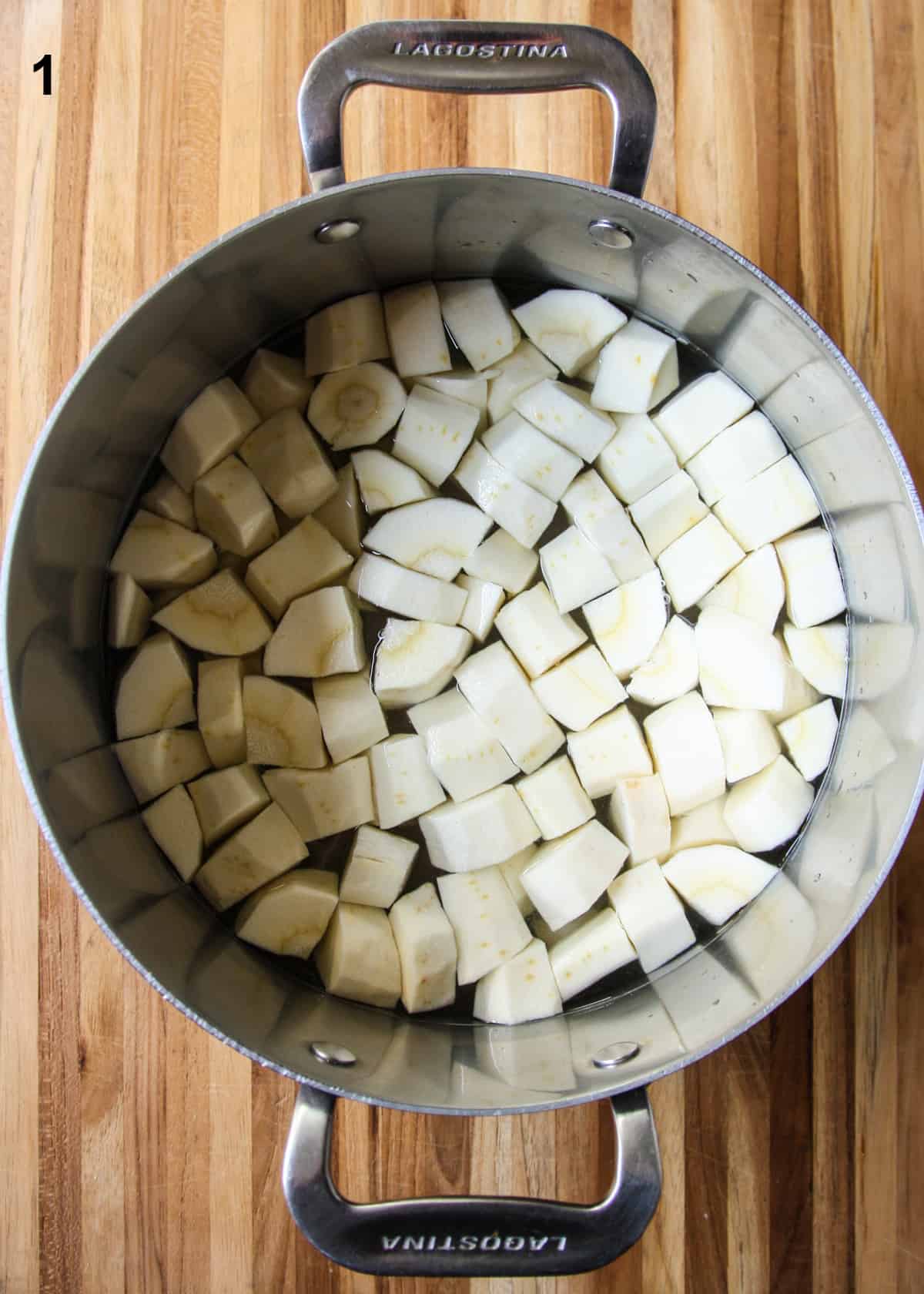 The parsnip pieces in a large pot of water.