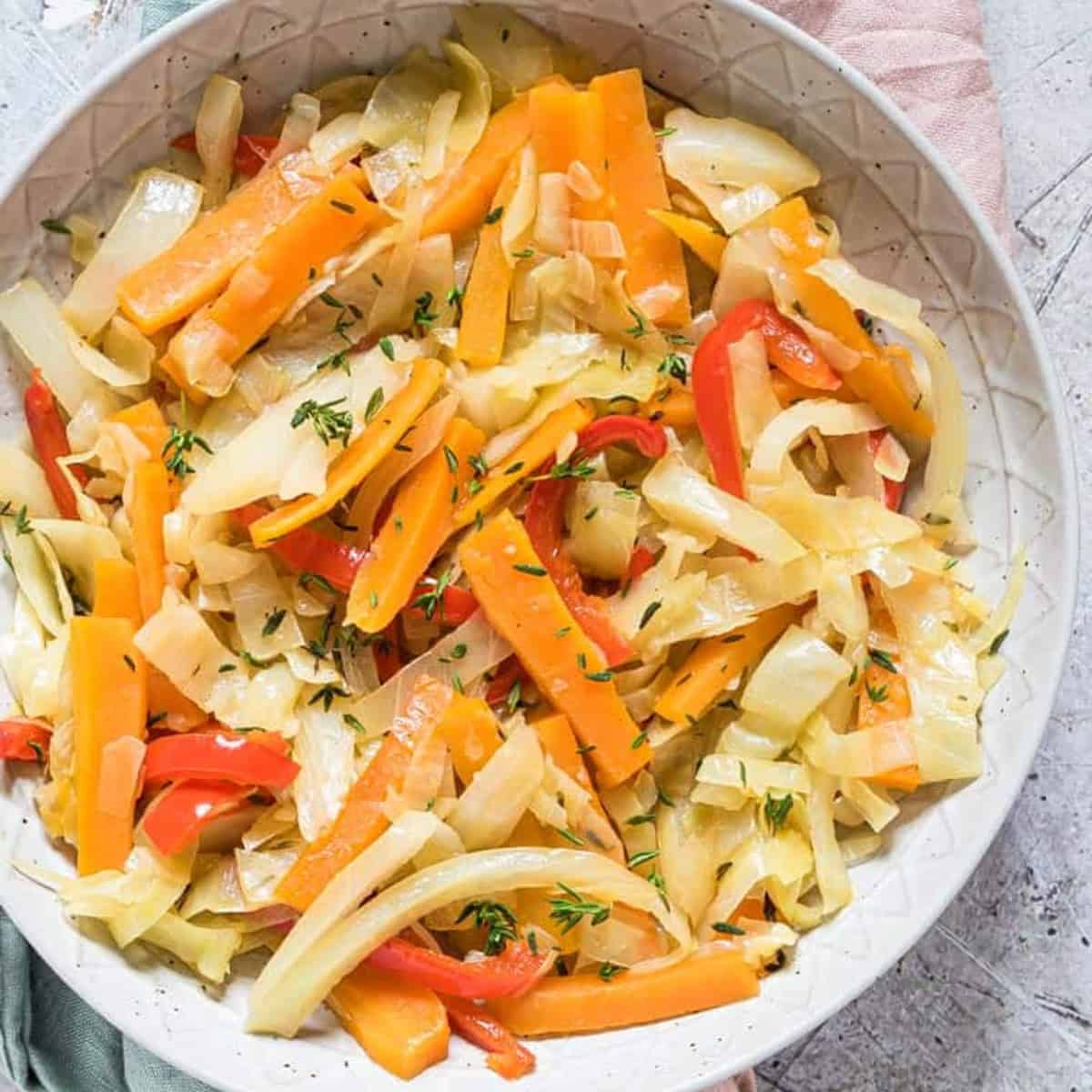 Jamaican cabbage in a white bowl.